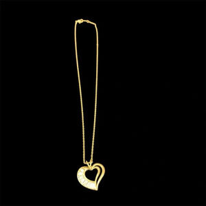 Avon goldtone necklace with heart shaped pendant with clear crystals 21”
